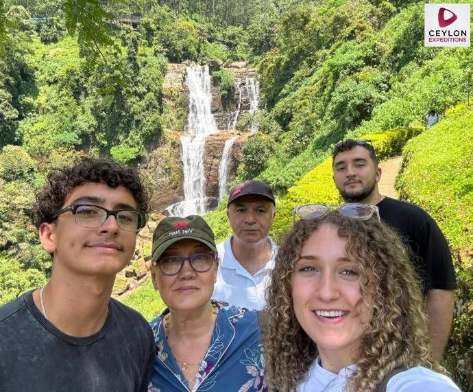 family-near-water-fall-sri-lanka-holiday-with-ceylon-expeditions-travels