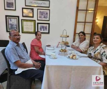 family-enjoying-tea-in-hotel